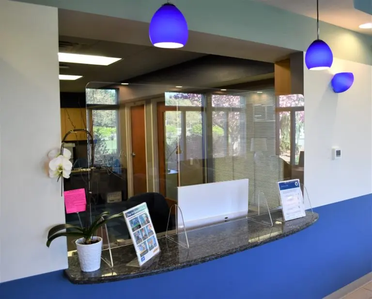 The bright front desk and reception area at East Coast Dental Design