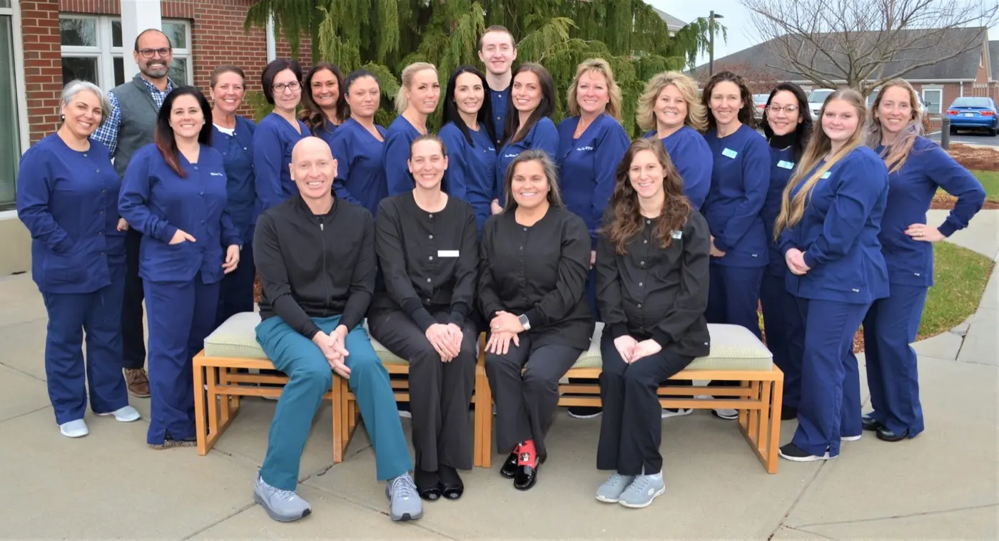 The East Coast Dental Design team posed outside the office